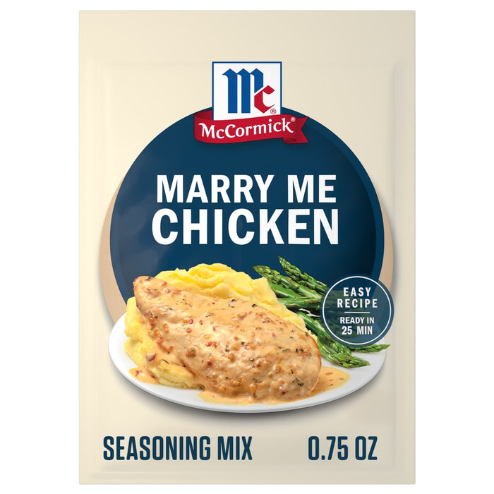 A packet of Mccormick Marry Me Chicken Seasoning Mix, 0.75 Oz, is shown in front of a plated serving suggestion of creamy chicken over mashed potatoes with asparagus.