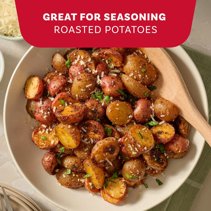 A bowl of roasted potatoes garnished with cheese and herbs shows a delicious use for Mccormick Marry Me Chicken Seasoning Mix, 0.75 Oz.