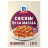 A packet of Mccormick Chicken Tikka Masala Seasoning Mix, 0.87 Oz, is shown with a prepared bowl of the creamy chicken dish served over rice.
