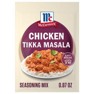 A packet of Mccormick Chicken Tikka Masala Seasoning Mix, 0.87 Oz, is shown with a prepared bowl of the creamy chicken dish served over rice.