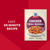 A packet of Mccormick Chicken Tikka Masala Seasoning Mix, 0.87 Oz, is displayed against a red background next to a serving suggestion of the finished dish over rice.