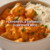 A close-up of a bowl of chicken tikka masala and rice, a flavorful and aromatic dish made using Mccormick Chicken Tikka Masala Seasoning Mix, 0.87 Oz.