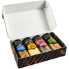 A gift box containing four bottles of BBQ rubs from the brand BBQ Guru.