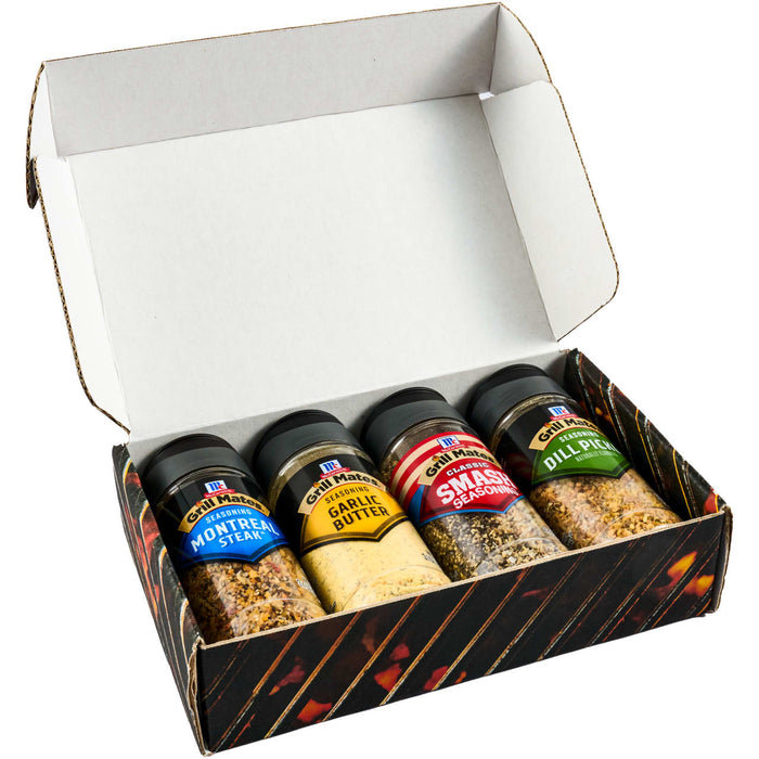 A gift box containing four bottles of BBQ rubs from the brand BBQ Guru.