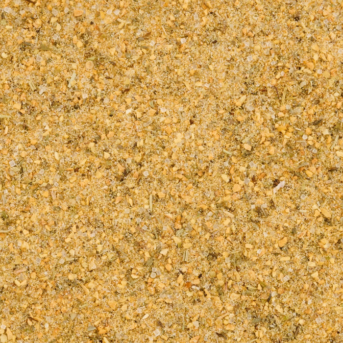 A close-up shows the granular Mccormick Sig Seas Garlic&amp;Olive Oil 5.25 Oz spice blend, composed of yellowish particles, white salt crystals, and small green herb pieces.