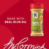 A bottle of Mccormick Garlic And Olive Oil Seasoning Blend, 5.25 Oz is shown against a red background with the text Made with Real Olive Oil.