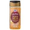 A clear shaker bottle of Mccormick Harry Potter Treacle Tart Finishing Sugar, 3.43 Oz, is shown against a white background, highlighting the golden-brown sugar crystals inside.