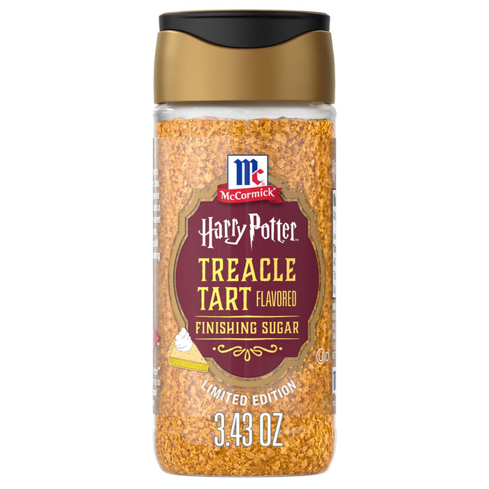 A clear shaker bottle of Mccormick Harry Potter Treacle Tart Finishing Sugar, 3.43 Oz, is shown against a white background, highlighting the golden-brown sugar crystals inside.