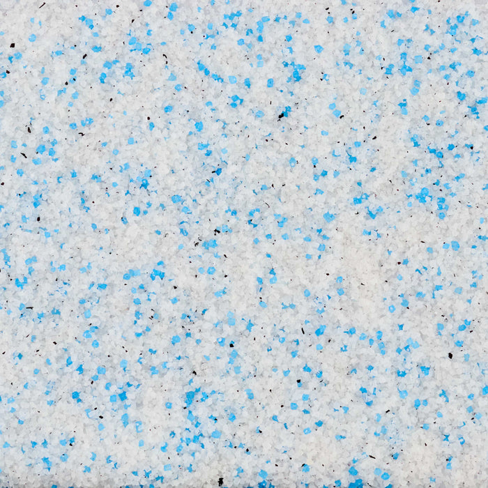 A close-up, top-down view reveals the texture of Mccormick Harry Potter Drooble'S Best Blowing Gum Finishing Sugar, 3.36 Oz, showing a mix of white, blue, and black sugar crystals.