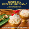 A whimsical ice cream sundae in a golden bowl is topped with whipped cream, a cherry, and a sprinkle of Mccormick Harry Potter Drooble'S Best Blowing Gum Finishing Sugar, 3.36 Oz.