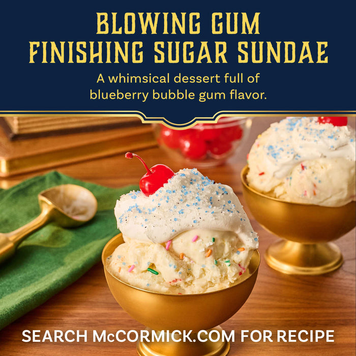 A whimsical ice cream sundae in a golden bowl is topped with whipped cream, a cherry, and a sprinkle of Mccormick Harry Potter Drooble'S Best Blowing Gum Finishing Sugar, 3.36 Oz.