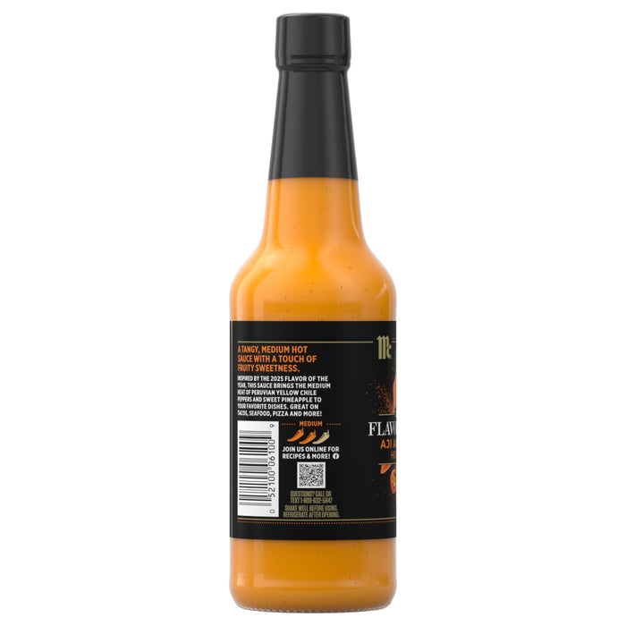 A bottle of Char Man Habanero Sauce with a black label and cap.