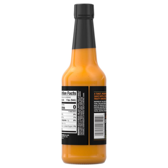 A bottle of hot sauce with a black label and cap.