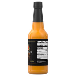 A bottle of Bravado Spice Co. Pineapple Habanero hot sauce with a black label and nutrition facts.