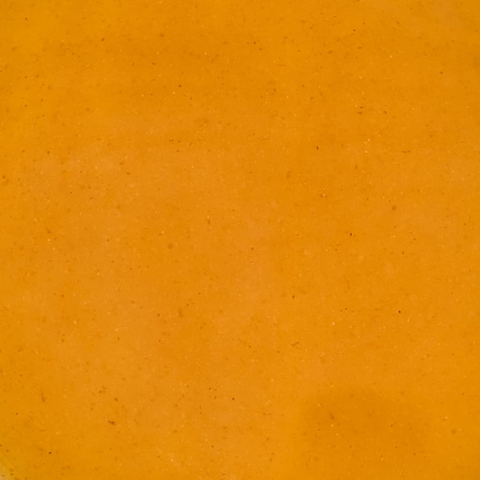 A smooth, vibrant orange background texture.