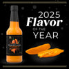 A bottle of Yellow Chili Elixir hot sauce is featured alongside the text 2025 Flavor of the Year.