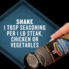 A hand holds a bottle of Mccormick Grill Mates Peppercorn And Worcestershire Seasoning Cracked 2.75 Oz next to text that reads, Shake 1 tbsp seasoning per 1 lb steak, chicken or vegetables.