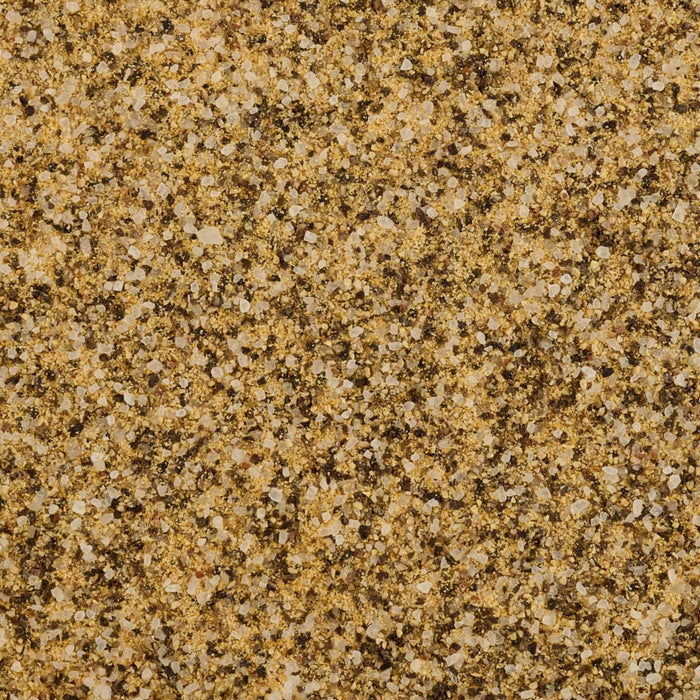 A close-up shows a mixture of ground salt and pepper.