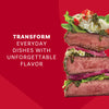 An appetizing stack of steak slices with rice and vegetables demonstrates the unforgettable flavor you can add to dishes using Mccormick Chimichurri Flavored Seasoning, 2.47 Oz.