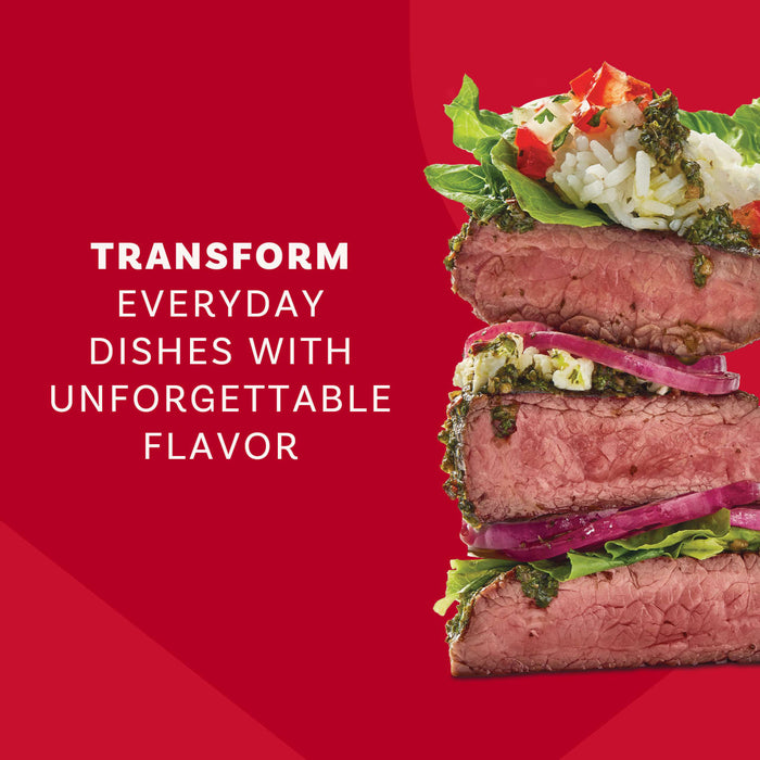 An appetizing stack of steak slices with rice and vegetables demonstrates the unforgettable flavor you can add to dishes using Mccormick Chimichurri Flavored Seasoning, 2.47 Oz.