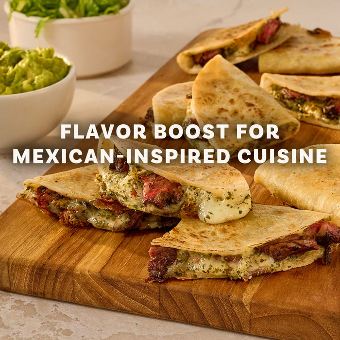 A wooden board displays several steak and cheese quesadillas, cut and filled with melted cheese and a green sauce, demonstrating a flavorful meal idea using Mccormick Chimichurri Flavored Seasoning, 2.47 Oz.