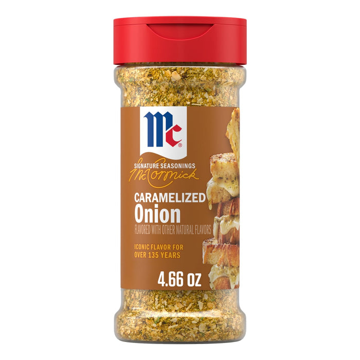 A clear bottle of Mccormick Caramelized Onion Seasoning, 4.66 Oz, is displayed with its signature red cap and a brown label that includes an image of cheesy bread.