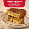 A perfectly toasted Caramelized Onion Grilled Cheese sandwich, a recipe idea using Mccormick Caramelized Onion Seasoning, 4.66 Oz, is cut in half and stacked on a plate to show the gooey melted cheese.
