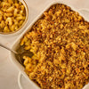 A large white casserole dish holds baked macaroni and cheese with a golden-brown breadcrumb topping made with Mccormick Caramelized Onion Seasoning, 4.66 Oz.