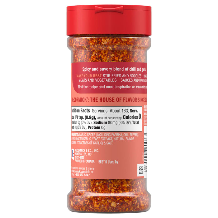 A clear bottle of Mccormick, 5.22 Oz spicy and savory blend of chili and garlic, showing the back of the label with the nutrition facts and ingredients.