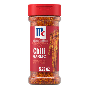 A clear bottle of Mccormick Chili Garlic Seasoning, 5.22 Oz, is displayed, showing the red and orange spice blend inside, with a red label and cap.