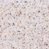 A close-up, top-down view shows the texture of Mccormick Blueberry And Lemon Finishing Sugar, 3.43 Oz, with its white sugar crystals mixed with dark specks of blueberry and yellow flecks of lemon.
