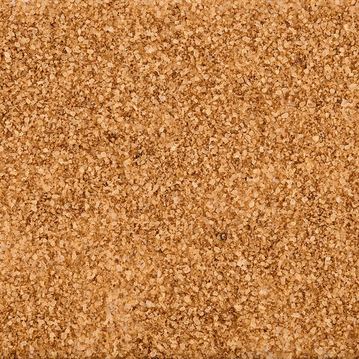 A close-up, top-down view reveals the granular texture of Mccormick Applewood Smoked Salt And Bacon Finishing Salt, 3.32 Oz.