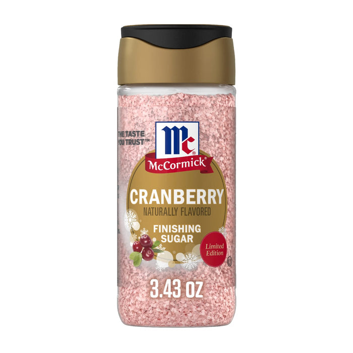 A clear plastic bottle of Mccormick Cranberry Finishing Sugar, 3.43 Oz featuring a gold and black cap and pink granulated sugar inside.