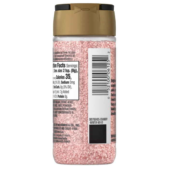 A back view of the Mccormick, 3.43 Oz cranberry flavored sugar bottle showing the nutrition facts and ingredients like beet powder and vanilla bean extractives.