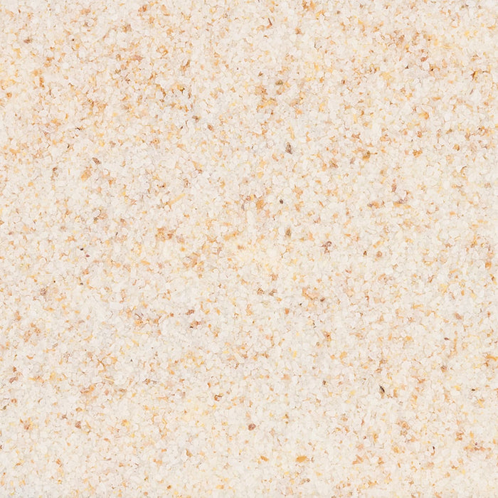 A close-up, top-down view reveals the texture of Mccormick Zesty Lemon Finishing Salt, 4.97 Oz, showing a blend of coarse white salt crystals with yellow and brown specks.