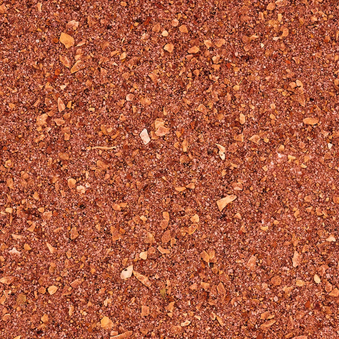 A close-up shows a mixture of coarse ground spices, possibly a seasoning blend.