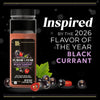 A bottle of McCormick 2026 Flavor of the Year Black Currant Seasoning is displayed with black currants and sliced red jalapeño peppers.