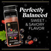 A bottle of McCormick Flavor of the Year 2026 Sweet &amp; Smoky Naturally Flavored Black Currant Seasoning is surrounded by black currants and sliced red jalapeño.
