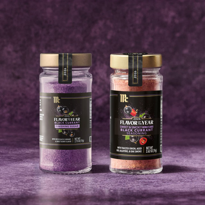 Two jars of McCormick Flavor of the Year 2026 seasonings are displayed, one Black Currant Finishing Sugar and one Sweet &amp; Smoky Naturally Flavored Black Currant Seasoning.