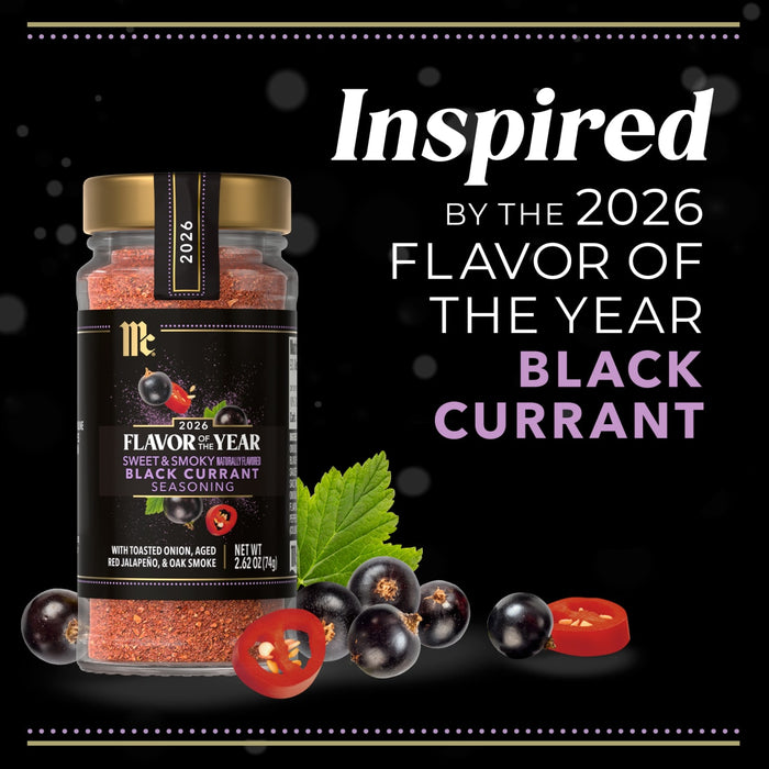 A jar of McCormick 2026 Flavor of the Year Sweet &amp; Smoky Naturally Flavored Black Currant Seasoning is displayed with black currants and sliced red jalapeño peppers.