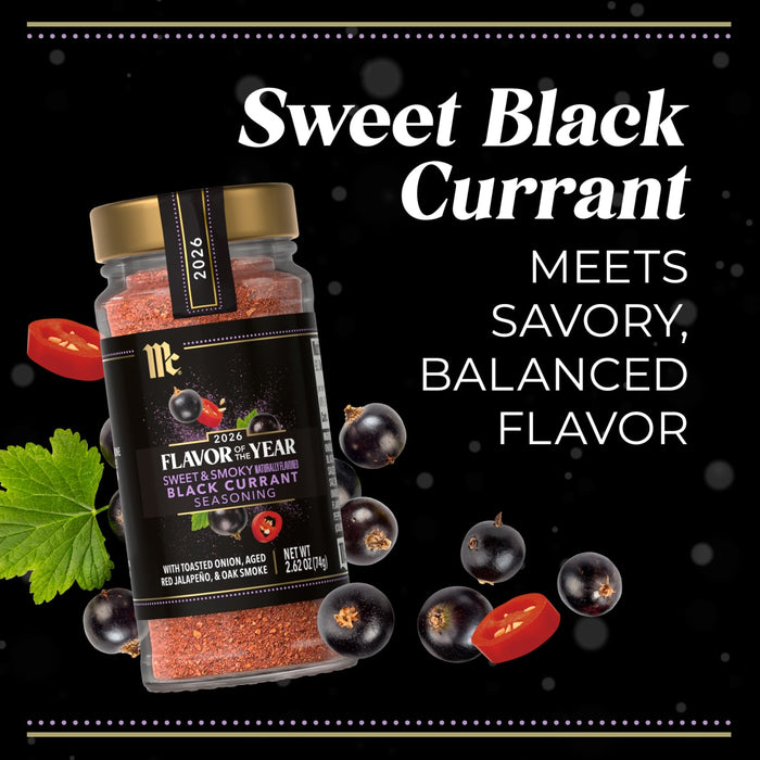 A jar of McCormick Flavor of the Year 2026 Sweet &amp; Smoky Naturally Flavored Black Currant Seasoning is surrounded by black currants and sliced red peppers.