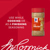 A bottle of Mccormick Spicy Sicilian Style Seasoning, 1.62 Oz, is displayed against a red background with text that reads, Use while cooking or as a finishing seasoning.