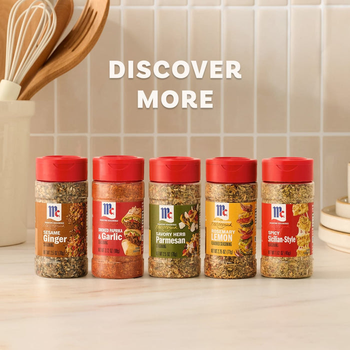 A lineup of five McCormick Signature Seasonings, including the Mccormick Savory Herb Parmesan Seasoning, 2.5 Oz, is displayed on a kitchen counter to encourage customers to discover more flavors.
