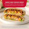 A delicious-looking Smoky Beef Crunch Wrap, a recipe that can be made using Mccormick Smoked Paprika And Garlic Seasoning, 3.12 Oz, is cut in half and stacked on a white plate to show the layers of beef, lettuce, and cheese inside.