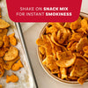 A bowl of snack mix and some on a baking sheet are shown seasoned with Mccormick Smoked Paprika And Garlic Seasoning, 3.12 Oz to add instant smokiness.