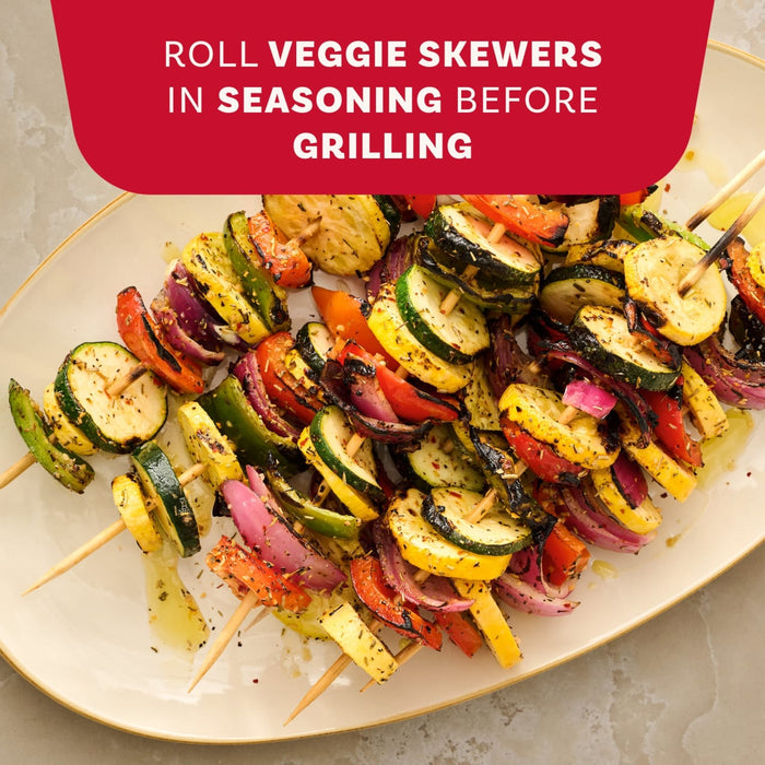 A plate of grilled vegetable skewers demonstrates a cooking tip to roll them in a seasoning like Mccormick Rosemary Lemon Seasoning, 2.75 Oz before grilling.