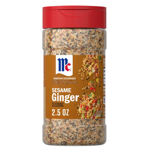 A clear plastic bottle of Mccormick Sesame Ginger Seasoning, 2.5 Oz, is shown with a red cap and a brown label featuring a serving suggestion of seasoned rice.