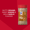 A bottle of Mccormick Sesame Ginger Seasoning, 2.5 Oz is displayed against a red background, with text on the left highlighting its Nutty Sesame, Sweet Ginger &amp; Bold Garlic Flavors.