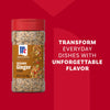 A promotional image displays a bottle of Mccormick Sesame Ginger Seasoning, 2.5 Oz, against a red background with the marketing slogan, Transform everyday dishes with unforgettable flavor.