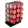 A black metal storage rack displays several red and other colored Nespresso Vertuo coffee pods.